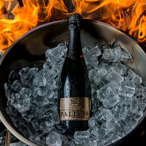 BALLERS CHAMPAGNE GOLD LABEL BRUT IN BUCKET OF ICE WITH ORANGE FLAMES